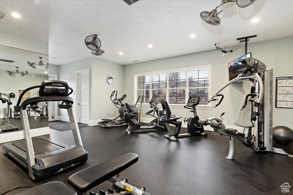 Exercise room featuring a textured ceiling