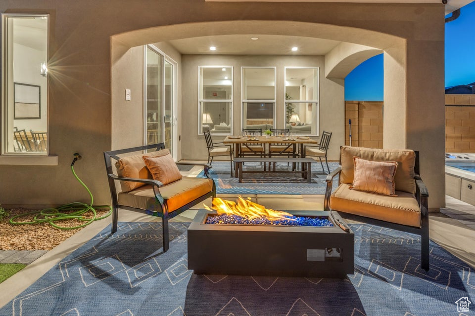 View of terrace with an outdoor living space with a fire pit