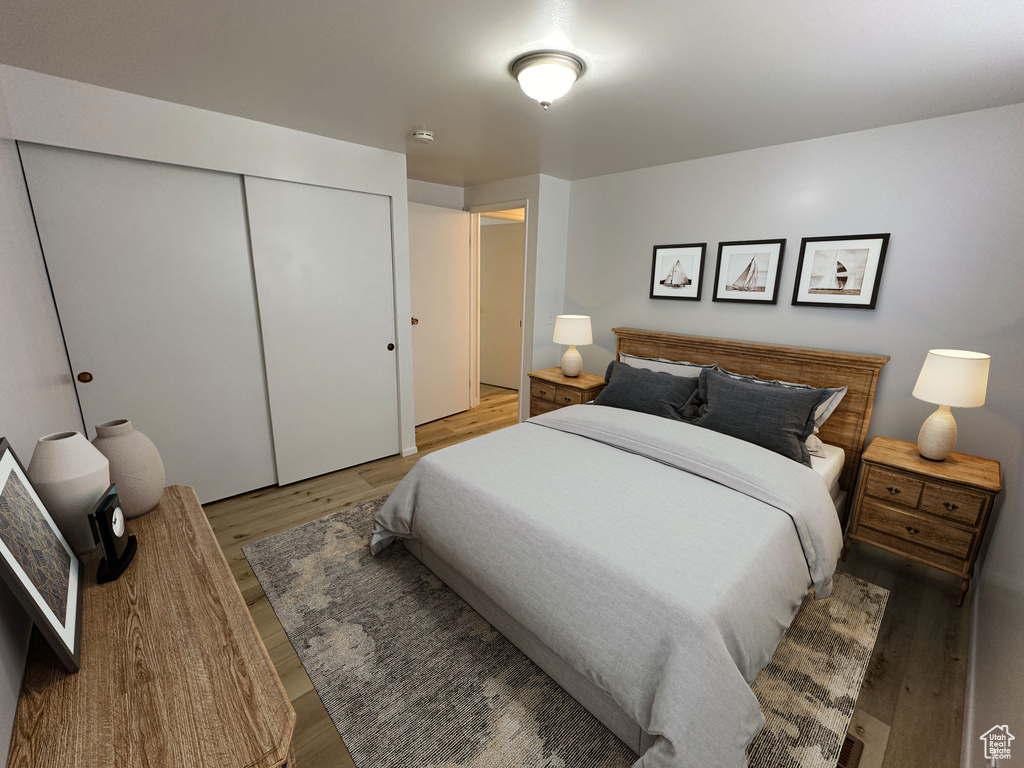Bedroom featuring hardwood / wood-style floors and a closet