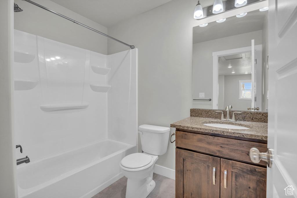 Full bathroom featuring shower / tub combination, oversized vanity, tile floors, and toilet