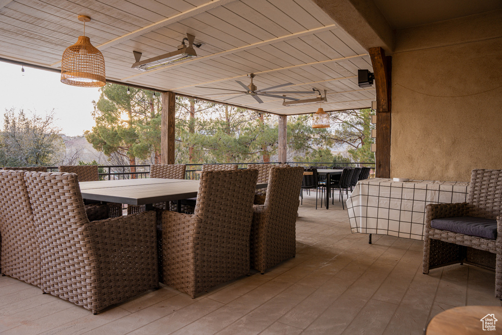 View of patio / terrace featuring an outdoor bar and ceiling fan