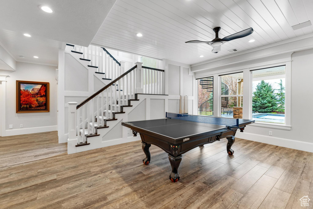 Recreation room featuring ceiling fan and light wood-type flooring