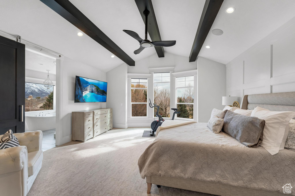 Carpeted bedroom featuring lofted ceiling with beams, ceiling fan, and multiple windows