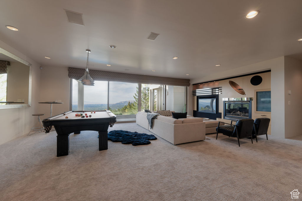 Rec room featuring light colored carpet and billiards