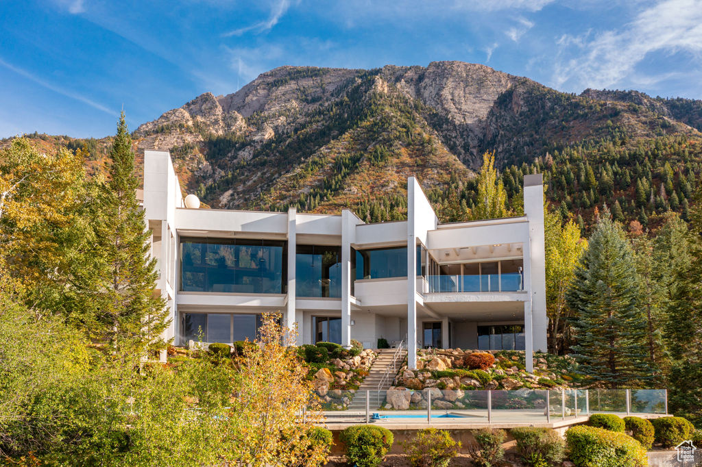 Exterior space featuring a mountain view and a balcony