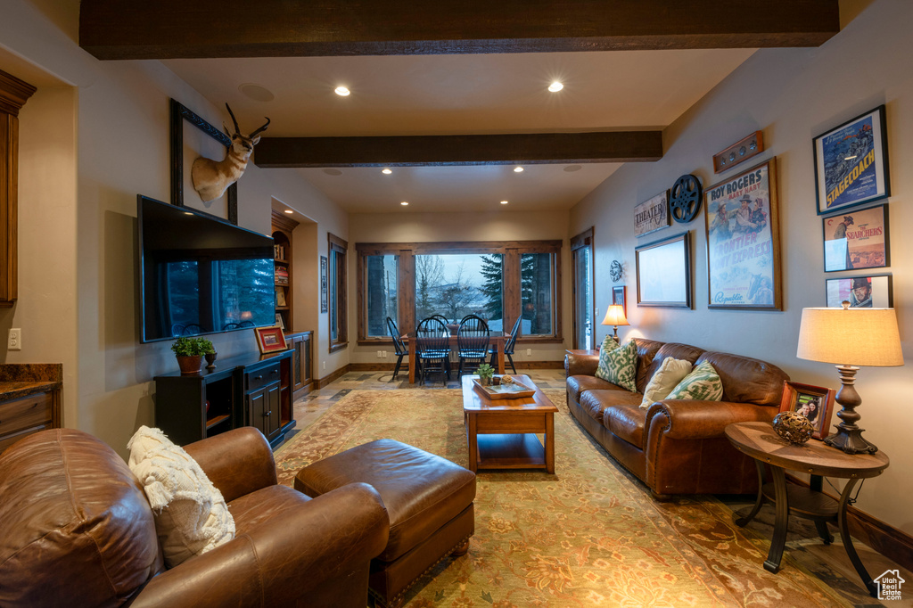 Living room featuring beam ceiling