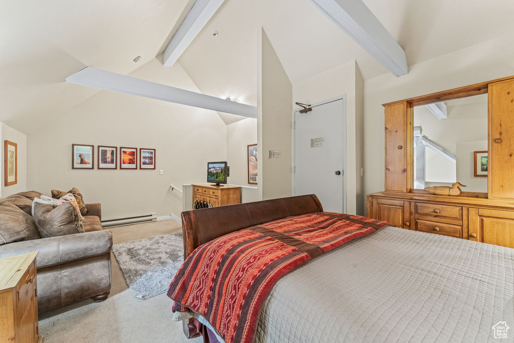 Carpeted bedroom featuring baseboard heating and vaulted ceiling with beams