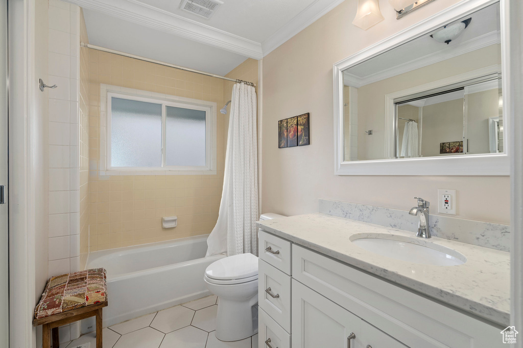 Full bathroom with shower / bath combination with curtain, crown molding, oversized vanity, toilet, and tile flooring