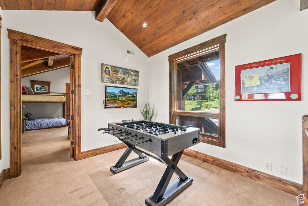 Game room featuring wooden ceiling, lofted ceiling with beams, and carpet floors