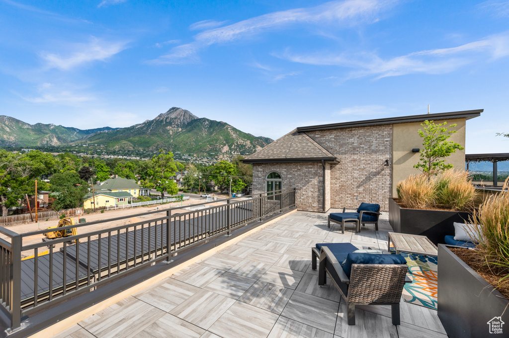 Deck featuring a patio area and a mountain view