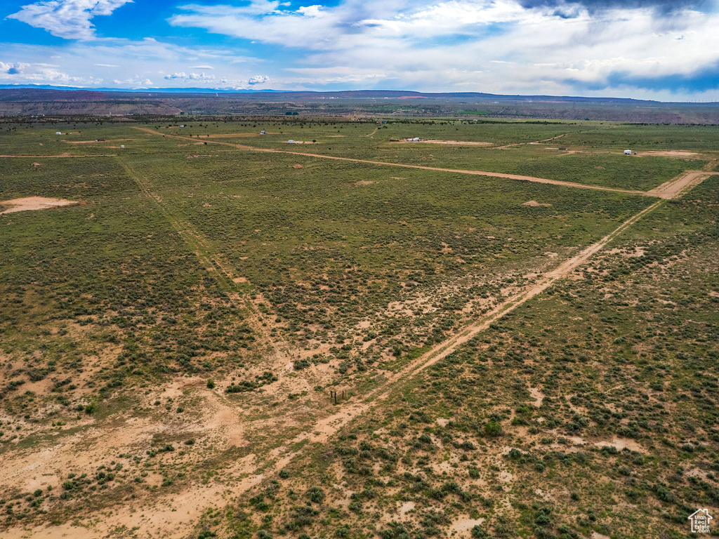 Birds eye view of property featuring a rural view