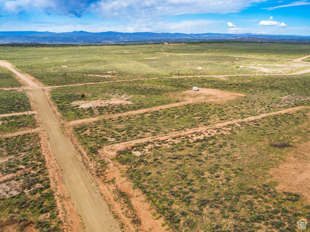 Birds eye view of property with a mountain view and a rural view