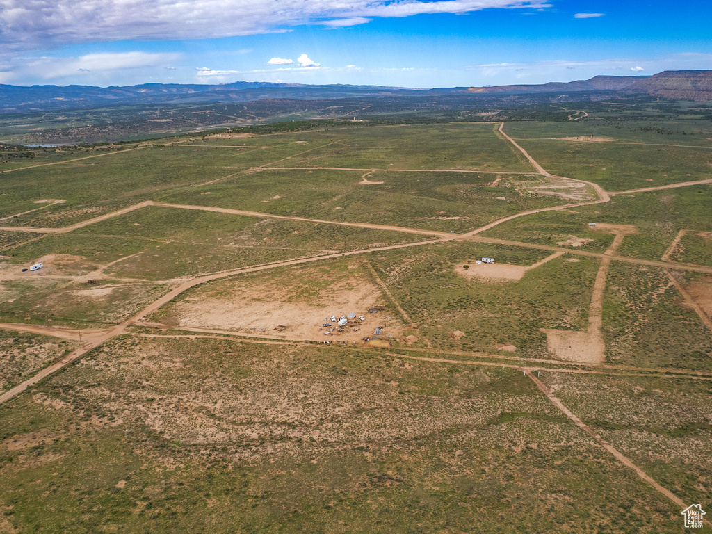 Birds eye view of property with a mountain view and a rural view