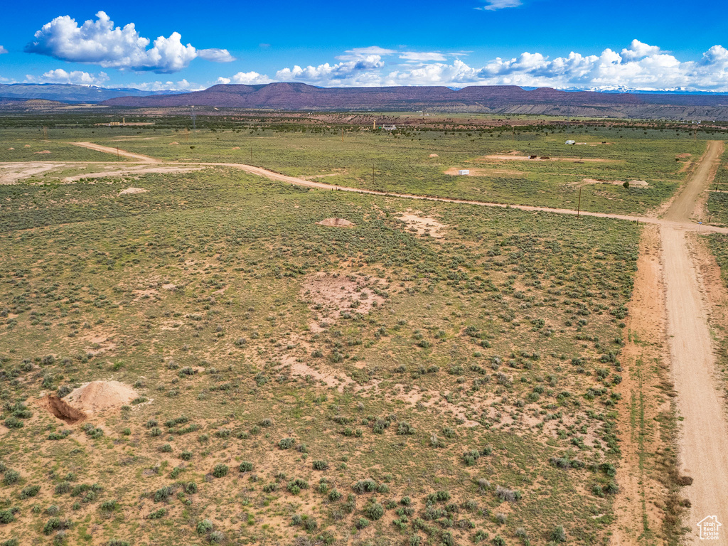 Birds eye view of property with a mountain view and a rural view