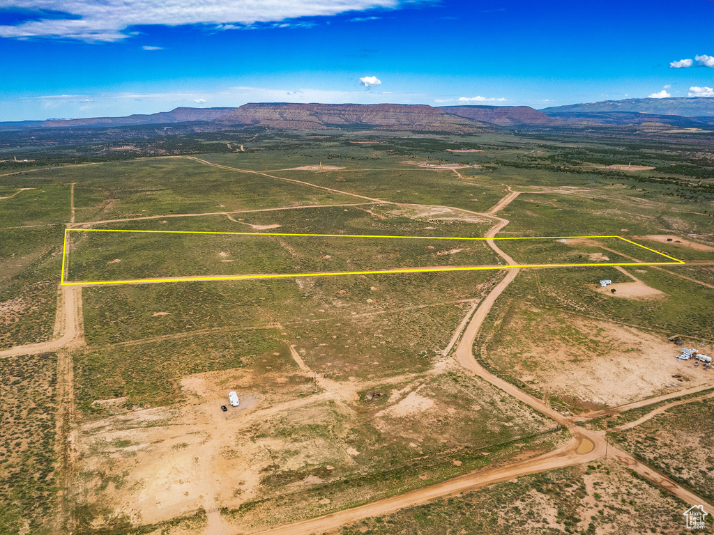 Birds eye view of property with a rural view and a mountain view