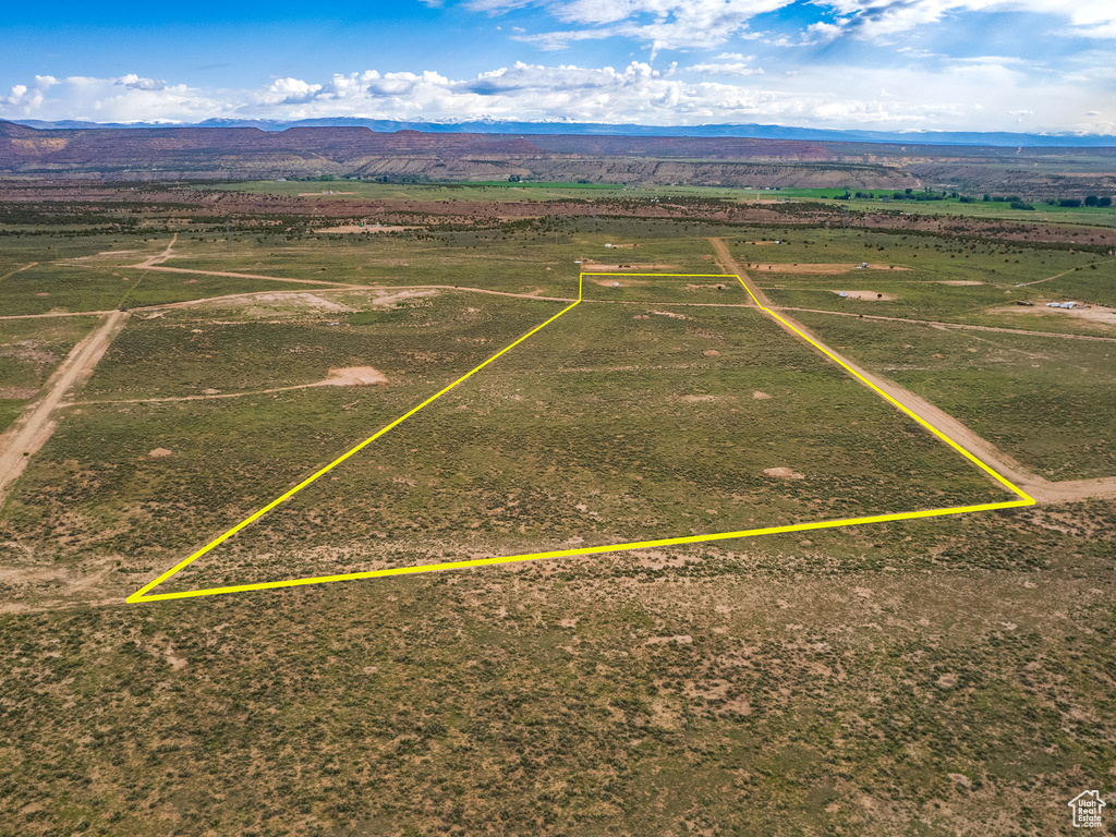 Birds eye view of property featuring a mountain view and a rural view