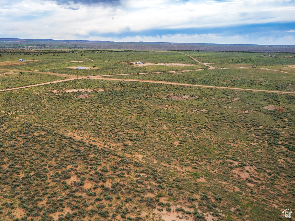 Birds eye view of property featuring a rural view