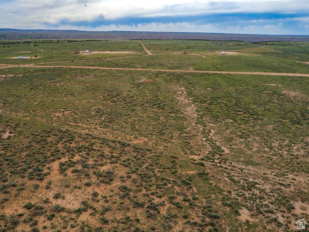 Birds eye view of property featuring a rural view