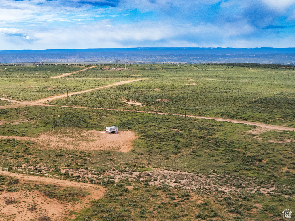 Birds eye view of property featuring a rural view