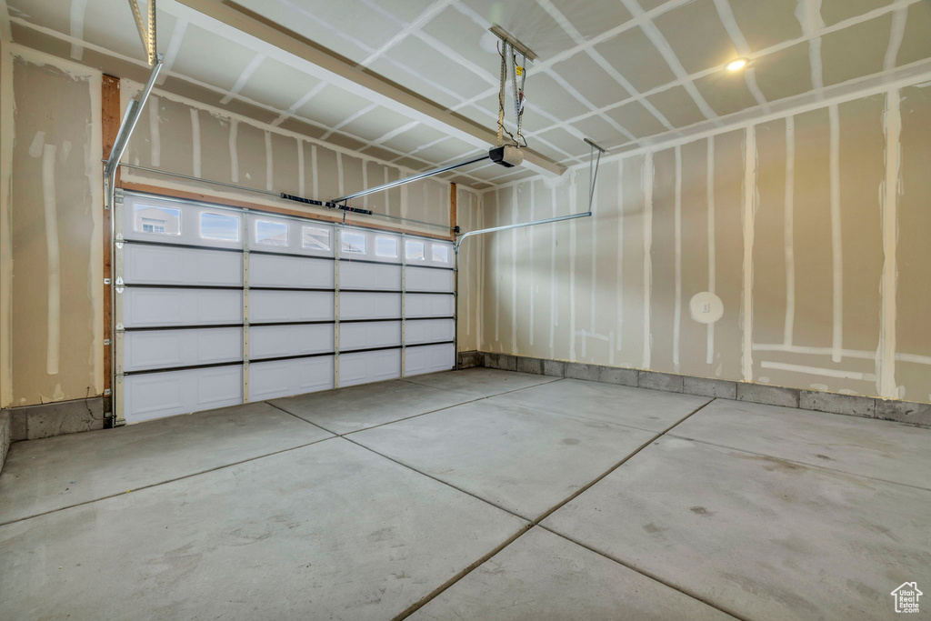 Garage featuring a garage door opener