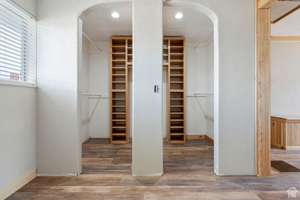 Wine room with dark hardwood / wood-style floors