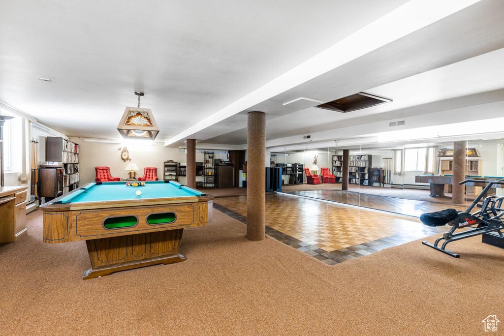 Recreation room with light colored carpet and billiards