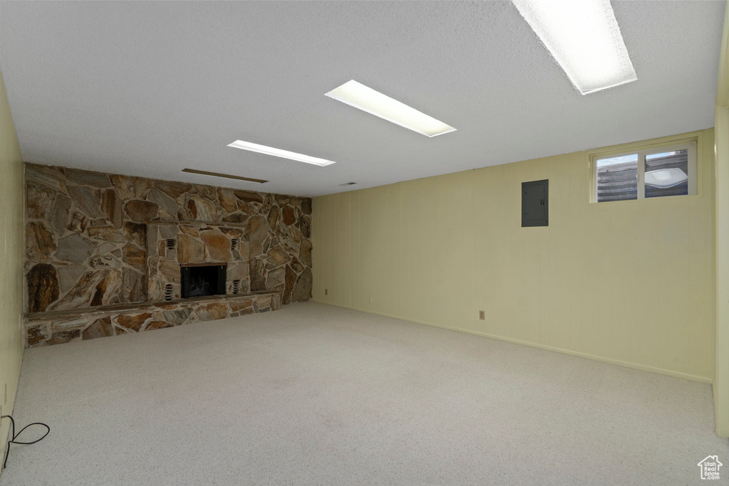 Basement featuring a fireplace and carpet floors