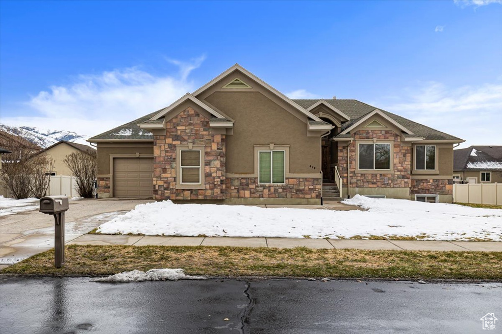 Craftsman-style house featuring a garage