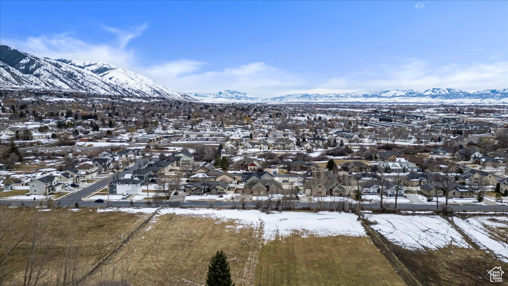 Snowy aerial view featuring a mountain view