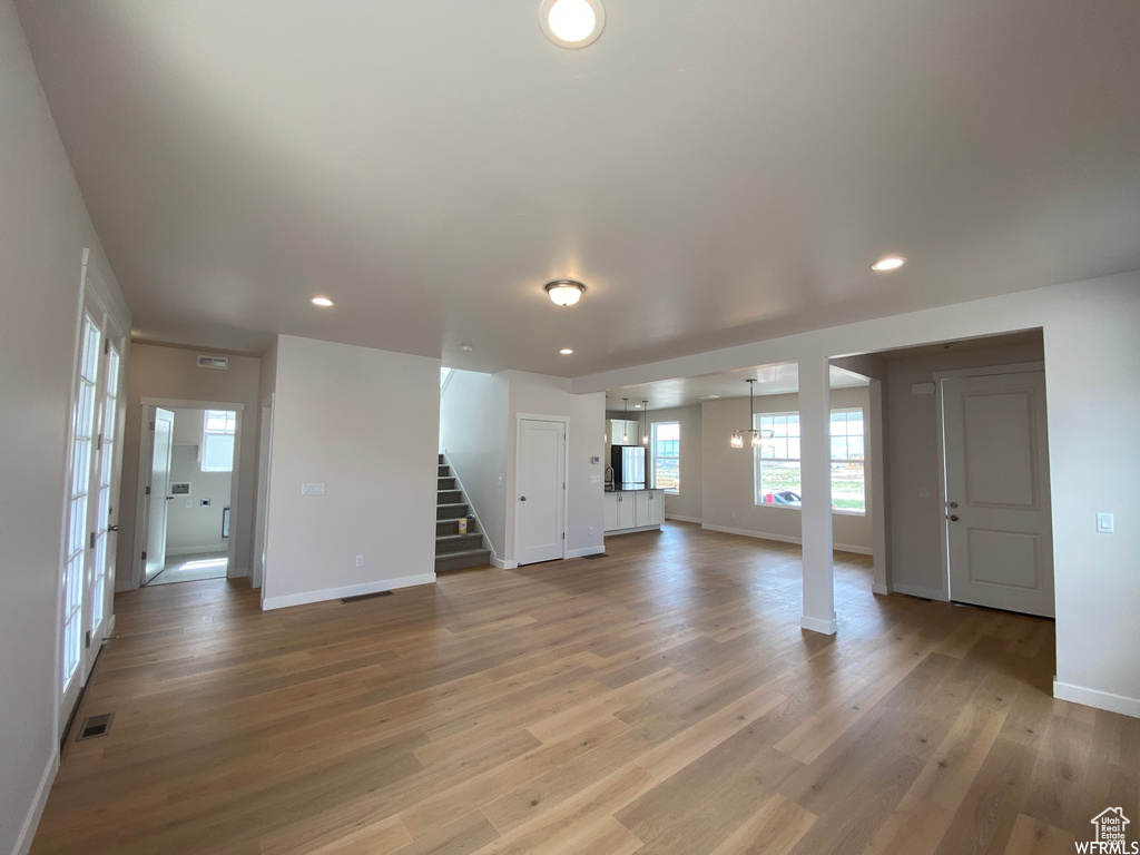 Unfurnished living room with hardwood / wood-style floors