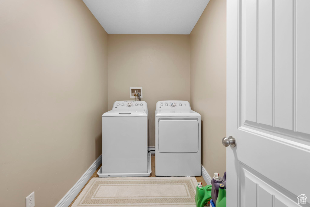 Laundry area with washing machine and clothes dryer and hookup for a washing machine