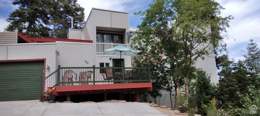 Rear view of house featuring a deck