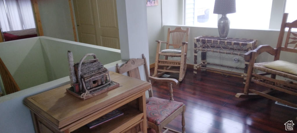 Sitting room featuring dark hardwood / wood-style flooring