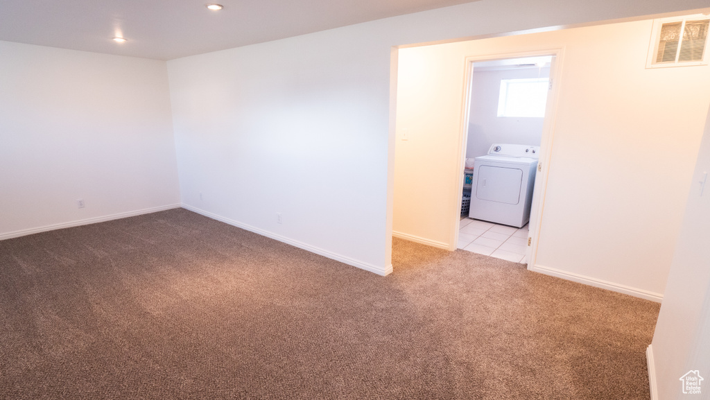 Carpeted empty room featuring washer / clothes dryer