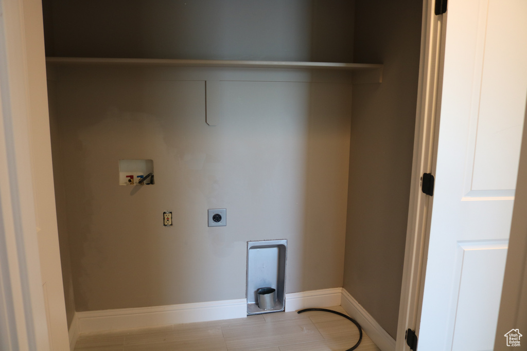 Laundry area with electric dryer hookup and washer hookup