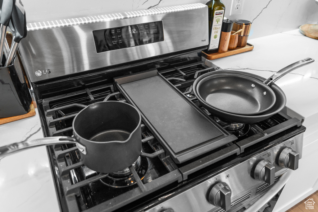 Details featuring stainless steel range with electric cooktop