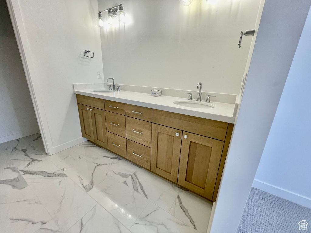 Bathroom with tile flooring and dual bowl vanity