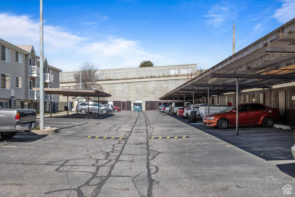 View of parking featuring a carport