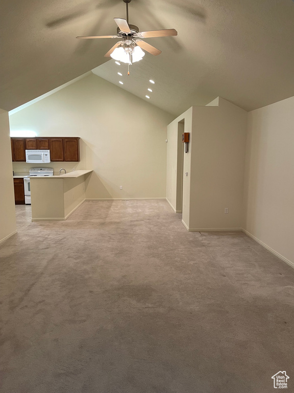 Bonus room featuring vaulted ceiling, ceiling fan, and light carpet