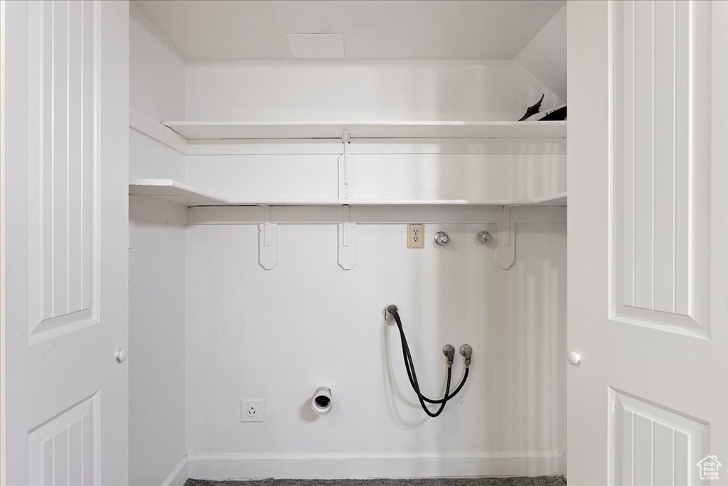 Washroom featuring washer hookup and carpet