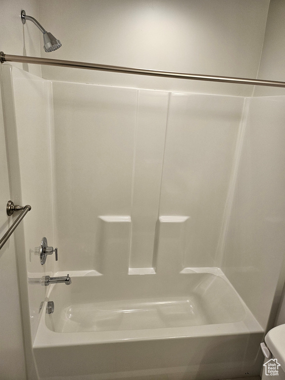 Bathroom with bathing tub / shower combination and toilet