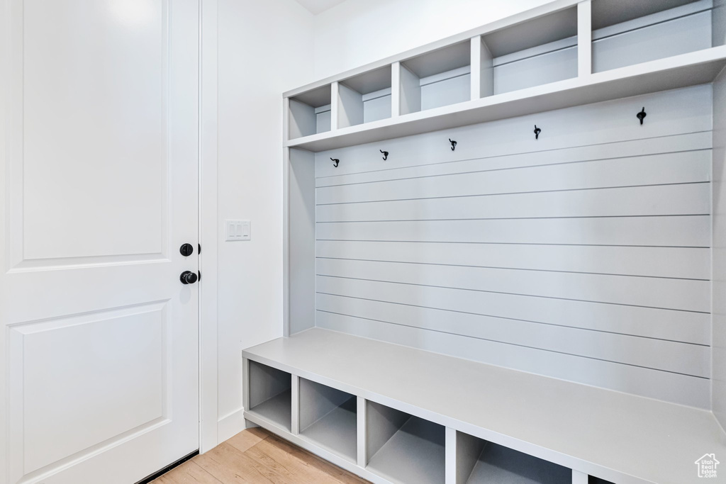 Mudroom with light hardwood / wood-style flooring