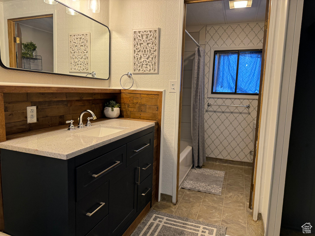 Bathroom featuring shower / tub combo, tile flooring, and large vanity