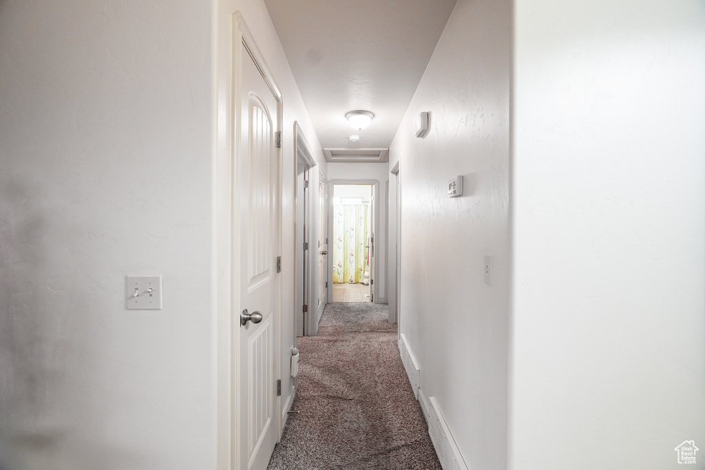 Corridor with dark carpet