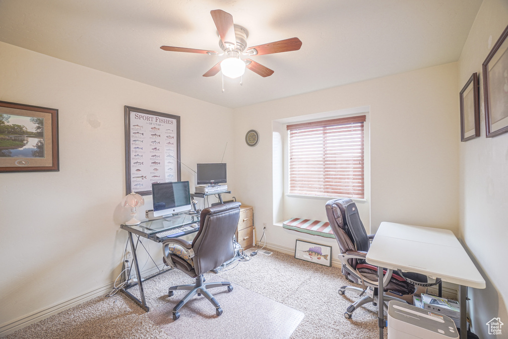 Office featuring light carpet and ceiling fan