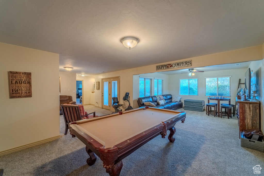 Game room with billiards, ceiling fan, and light colored carpet