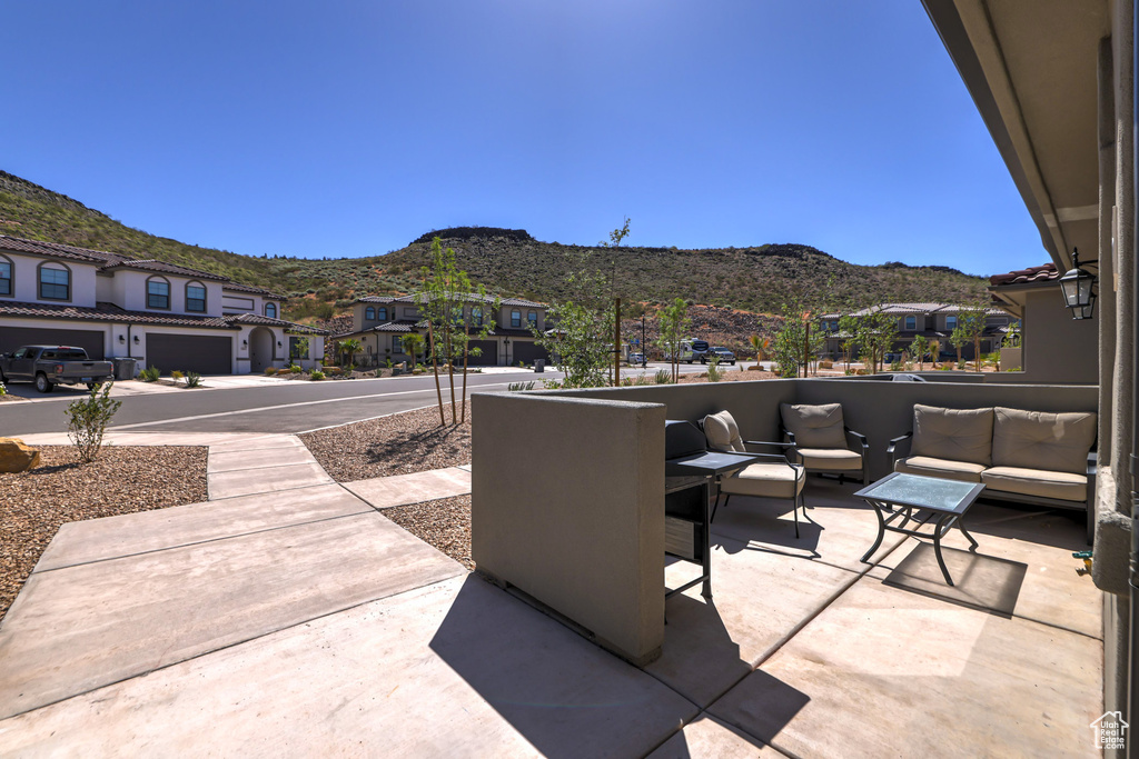 View of patio / terrace with a mountain view