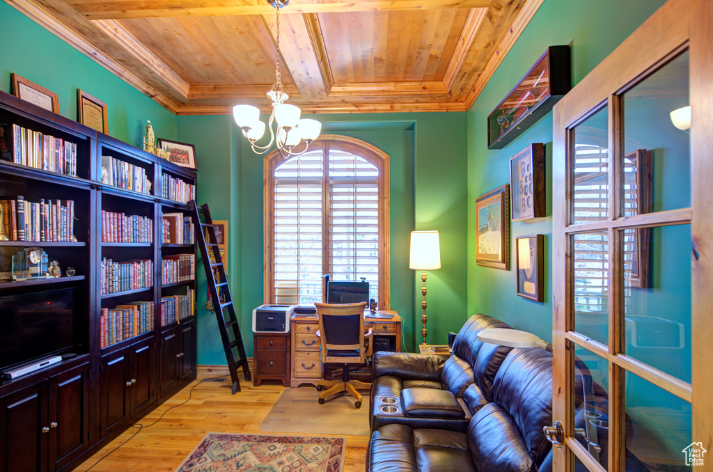Office area with a chandelier, crown molding, light hardwood / wood-style floors, and wood ceiling