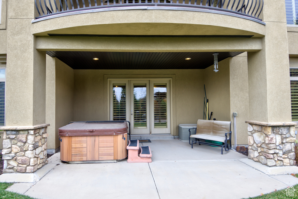 View of patio / terrace with a hot tub