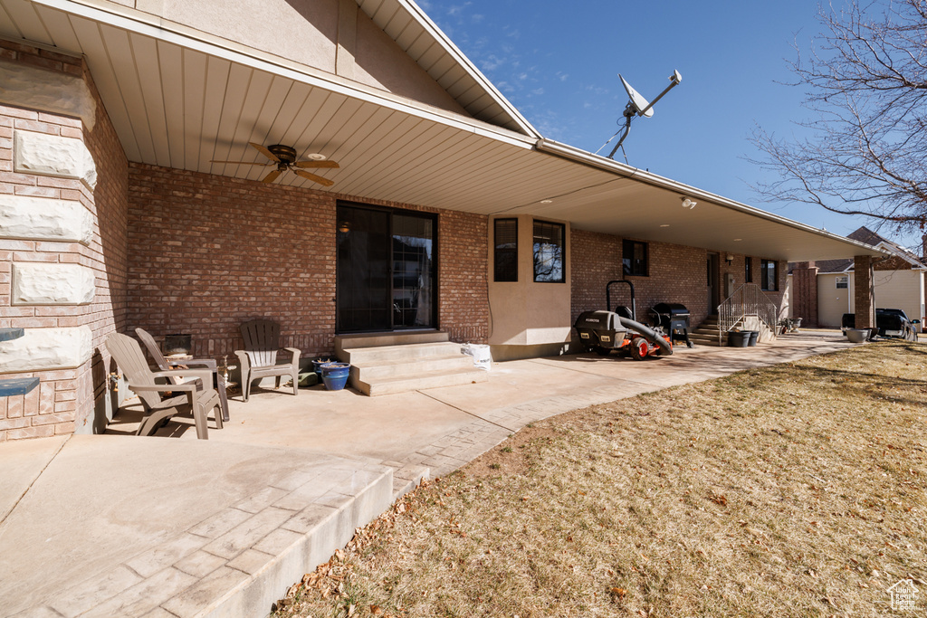 Back of property with a patio and ceiling fan